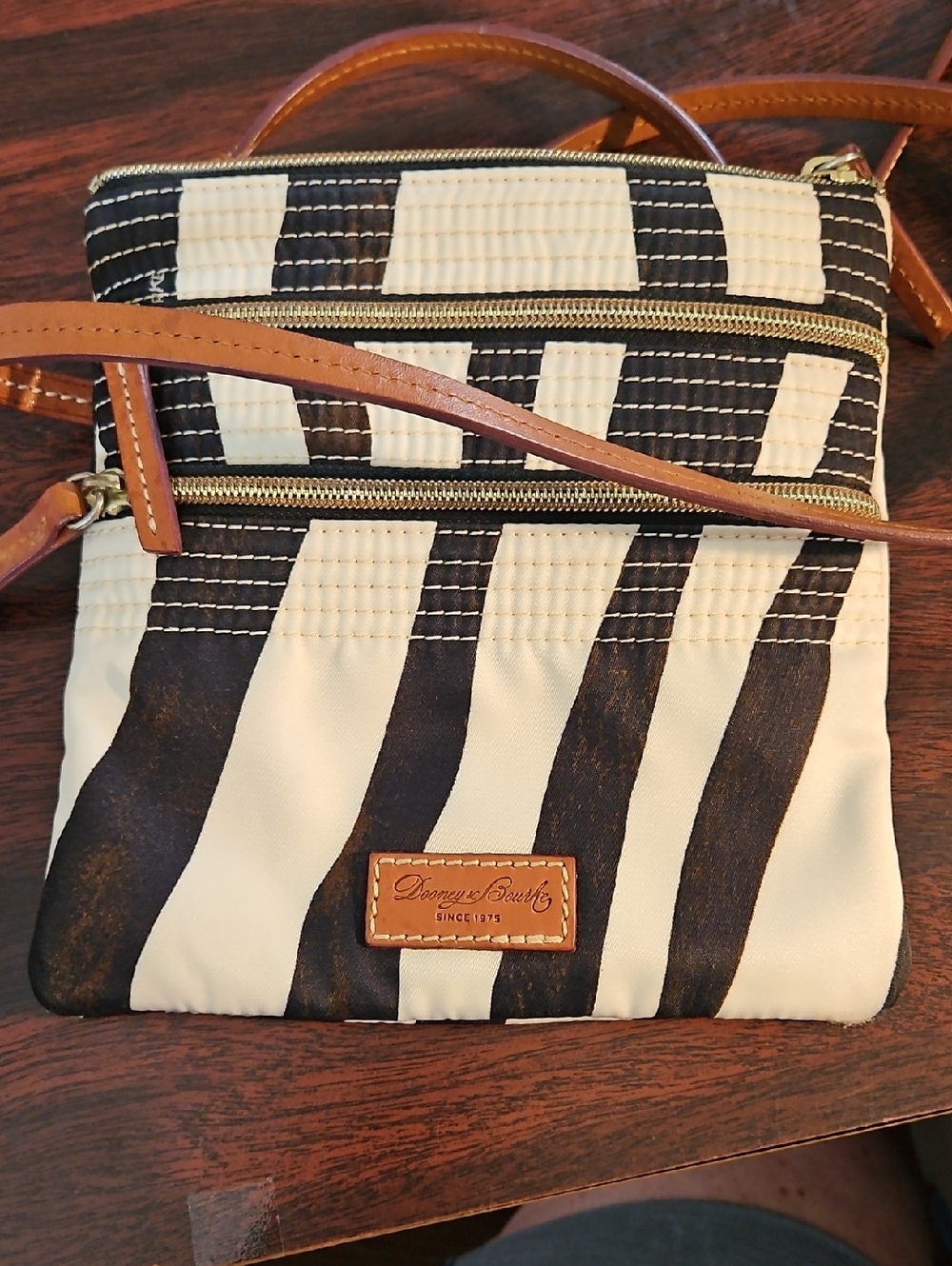 Dooney & Bourke Black and Cream Striped Crossbody with Tan Strap